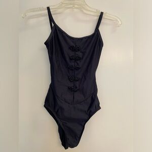 Motion wear black camisole leotard with frog braid details. Size adult small.